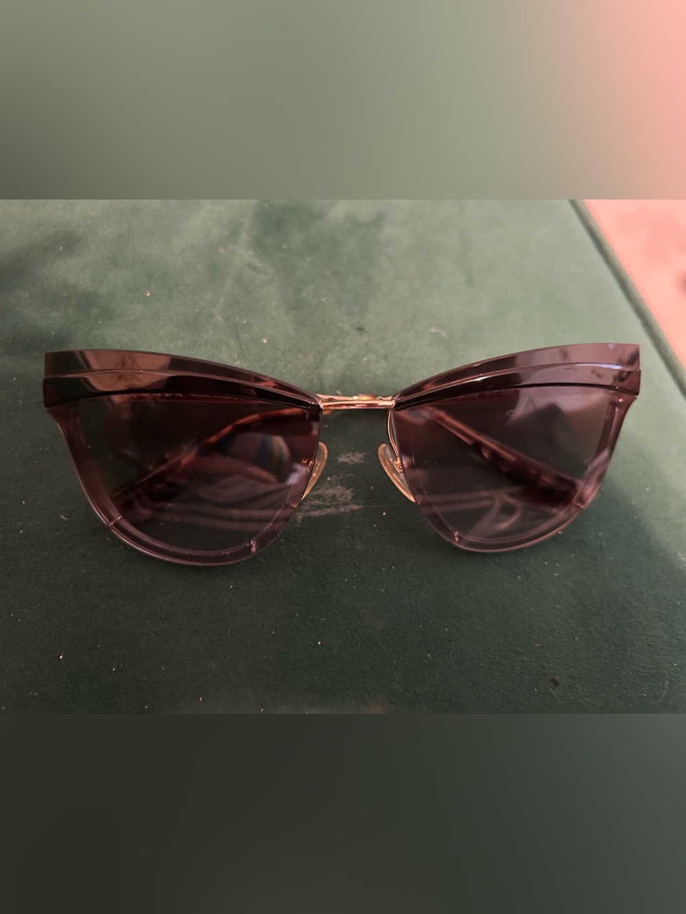 Prada Cinéma Cat-Eye sunglasses with a transparent frame and gold-tone metal